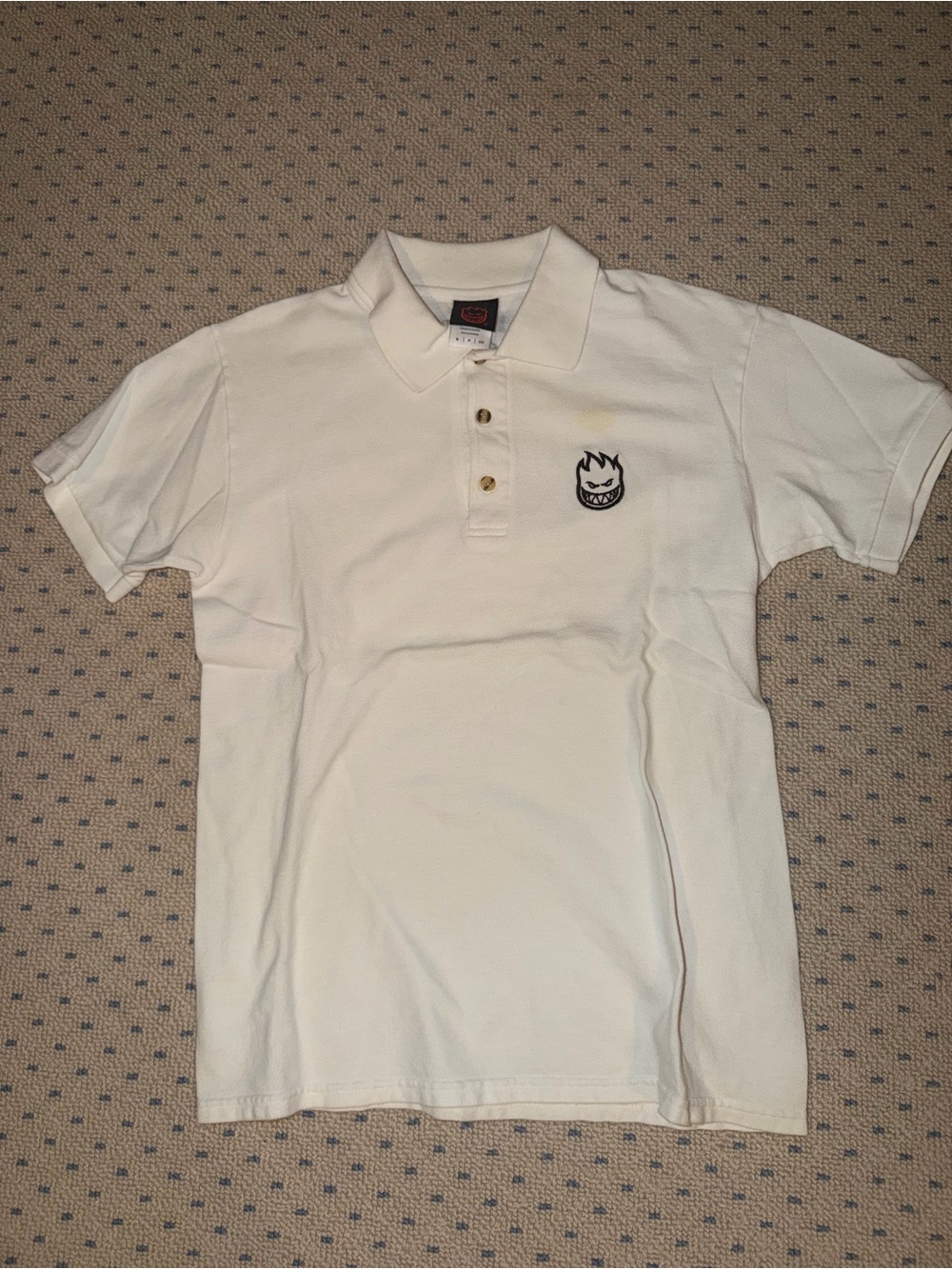 White Spitfire Polo Shirt with Embroidered Flame Face Logo